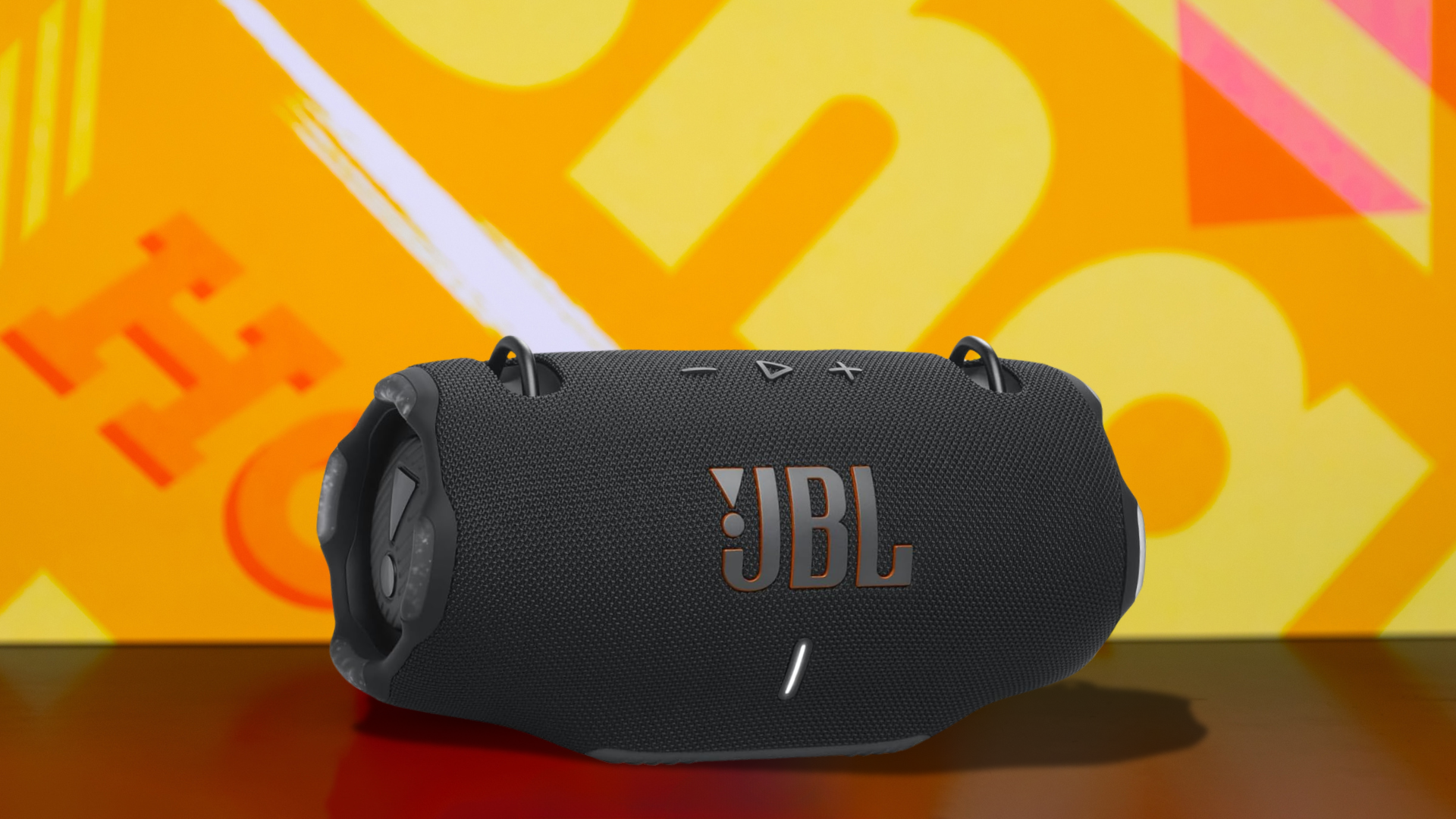 A JBL Extreme 4 speaker on a colorful background