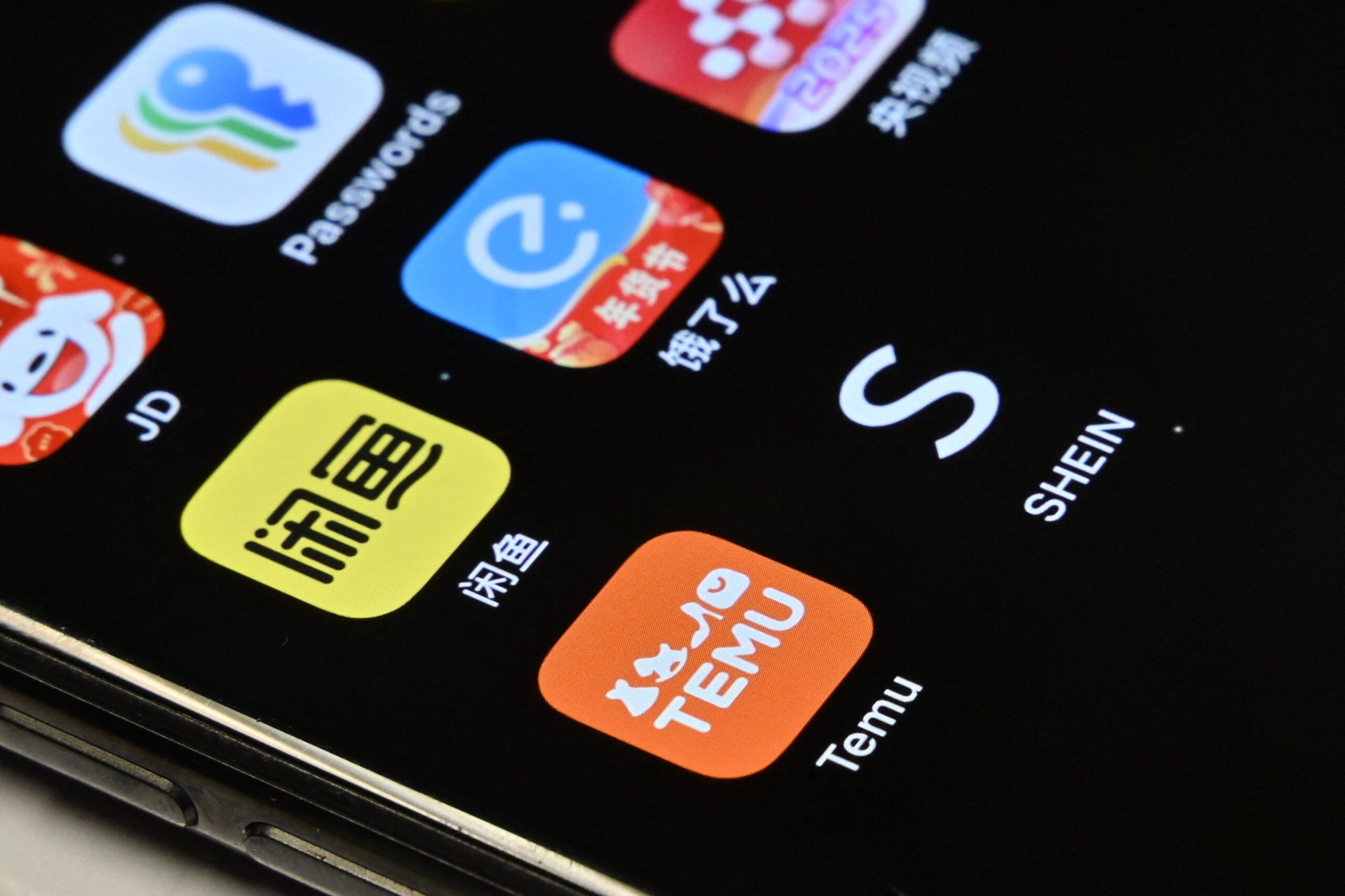 Temu and Shein e-commerce apps on a mobile phone