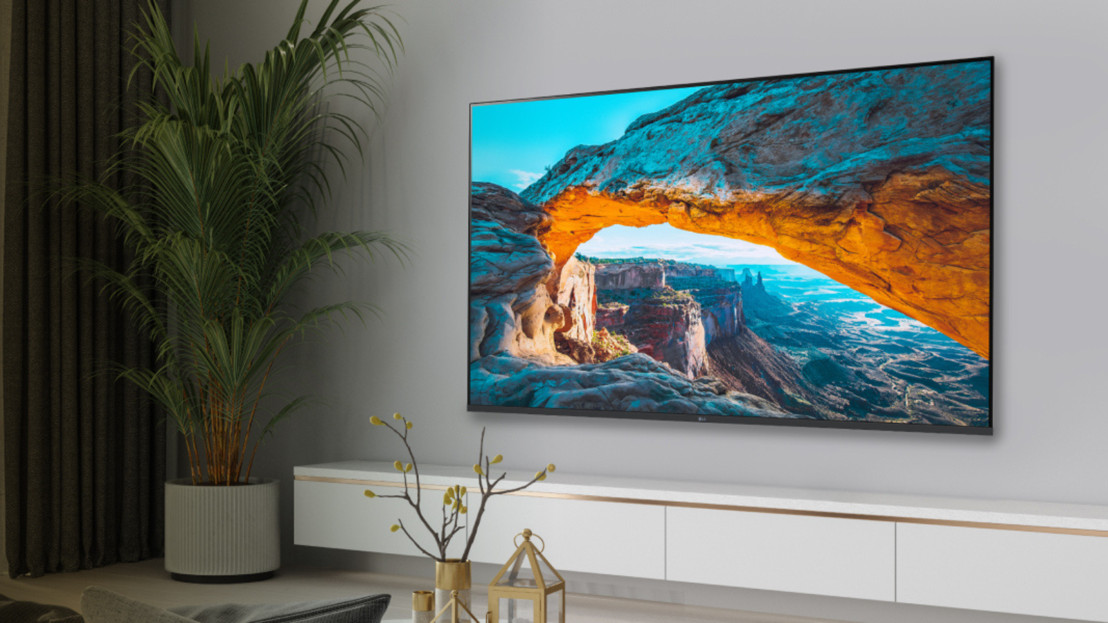 LG 55-inch UT75 4K TV hanging on wall in living room