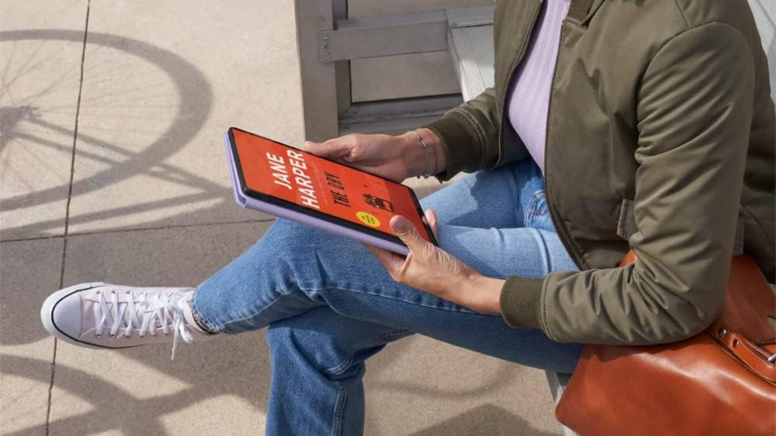 person using Amazon Fire Max 11 tablet to read