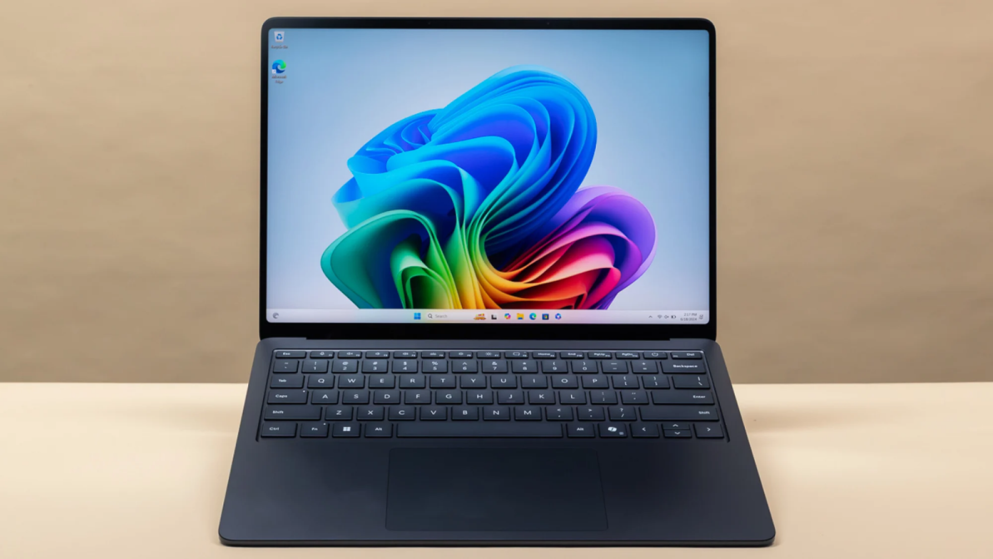 the 13-inch microsoft surface laptop 7 against a beige background