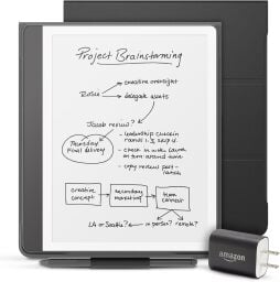 The Kindle Scribe Essentials Bundle, including pen, folio, and power adapter, on a white background