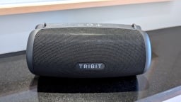 black tribit speaker sitting on a counter top