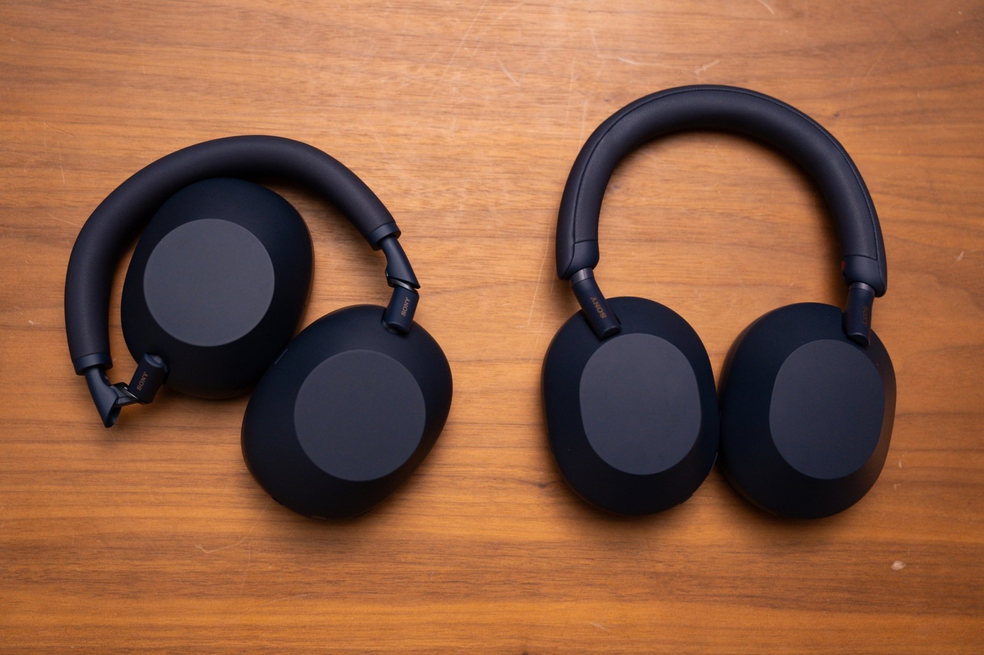the xm6 headphones folded up next to xm5 headphones