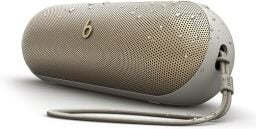 A champagne gold Beats Pill speaker on a white background