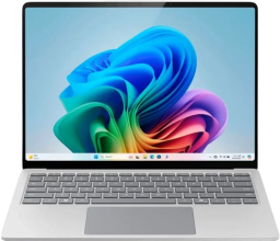 A Microsoft Surface laptop appears with an abstract image on its screen.