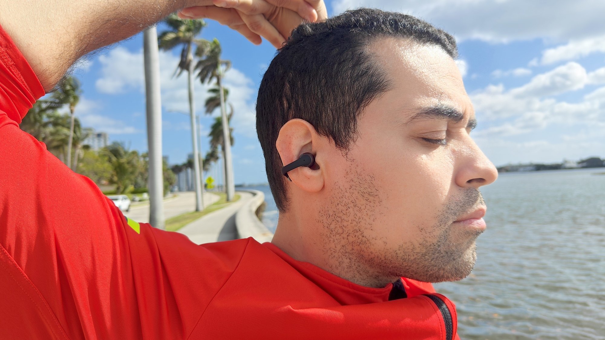 The author earing the shokz opendots one earbuds