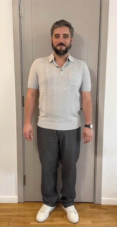 AI-generated image of man wearing gray polo