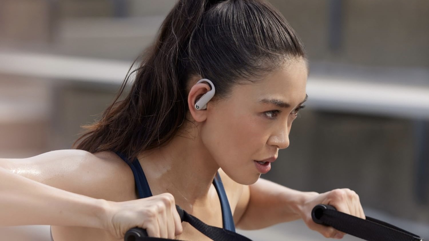person exercising wearing gray powerbeats pro 2