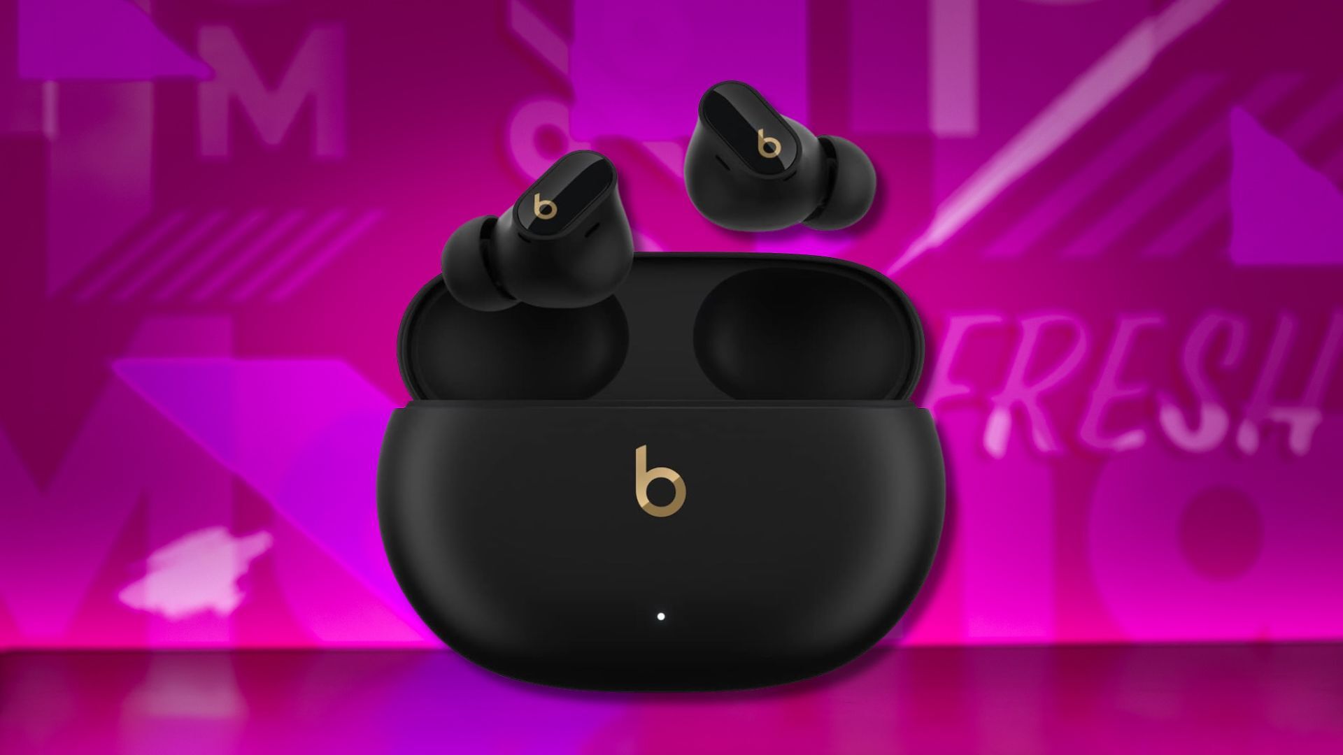 beats studio buds plus earbuds against a pink patterned background