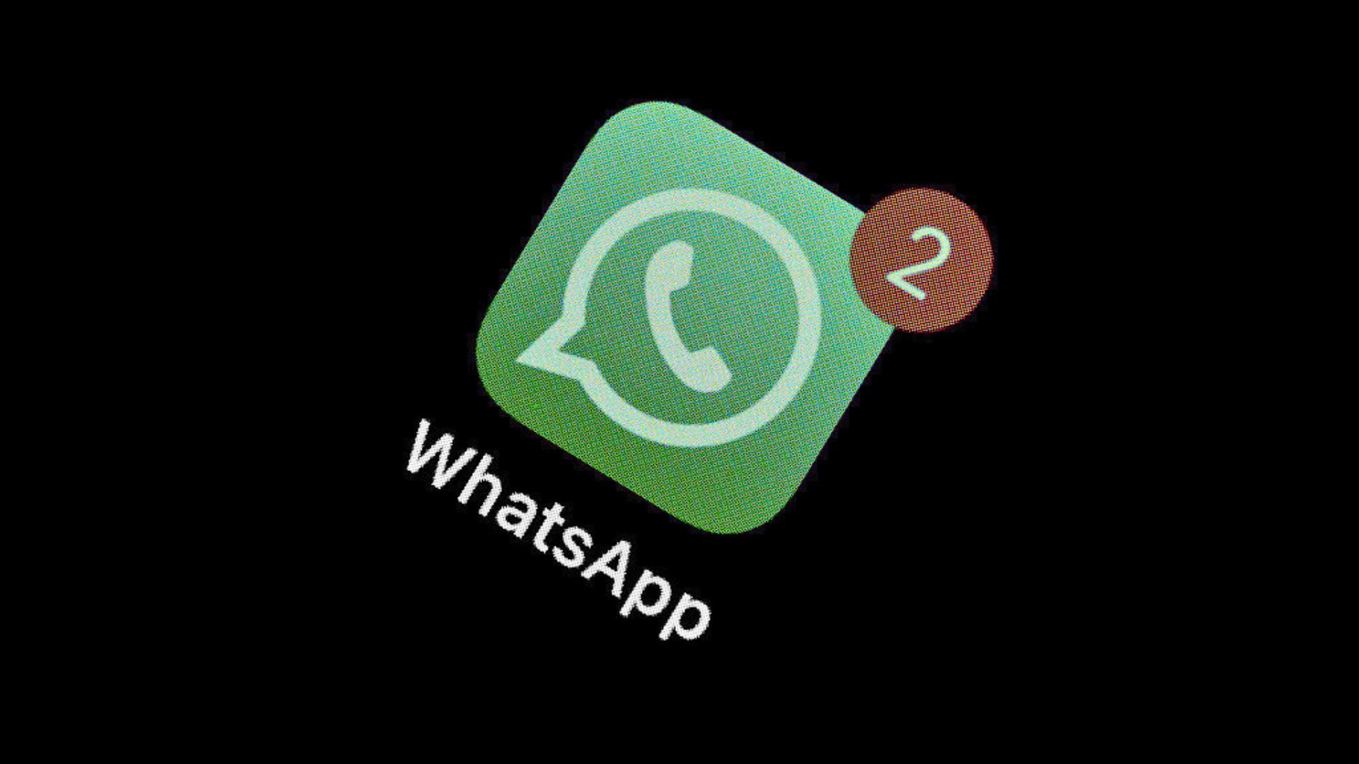 The WhatsApp application can be seen on the display of a smartphone.