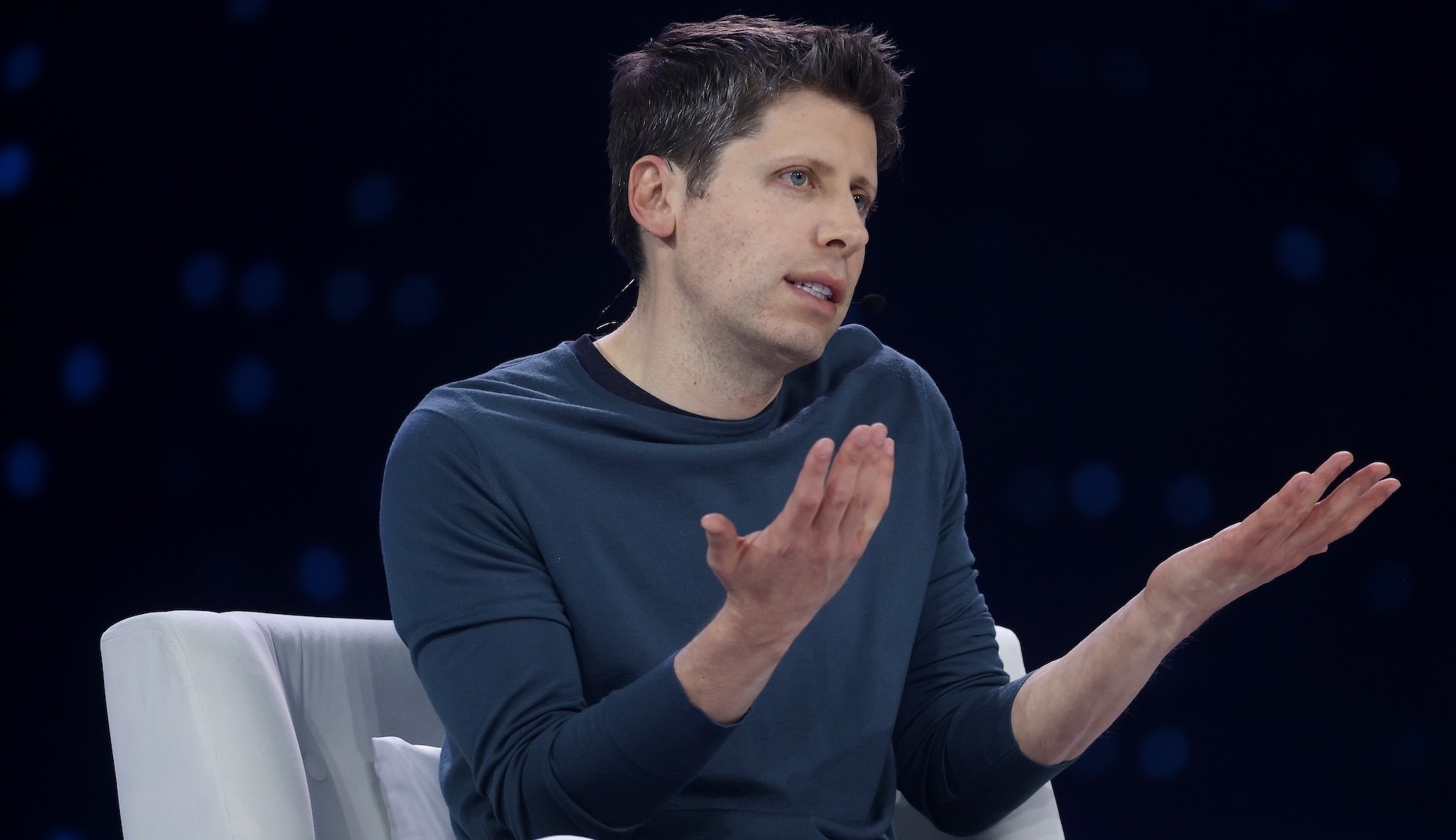 Sam Altman shrugs his shoulders.
