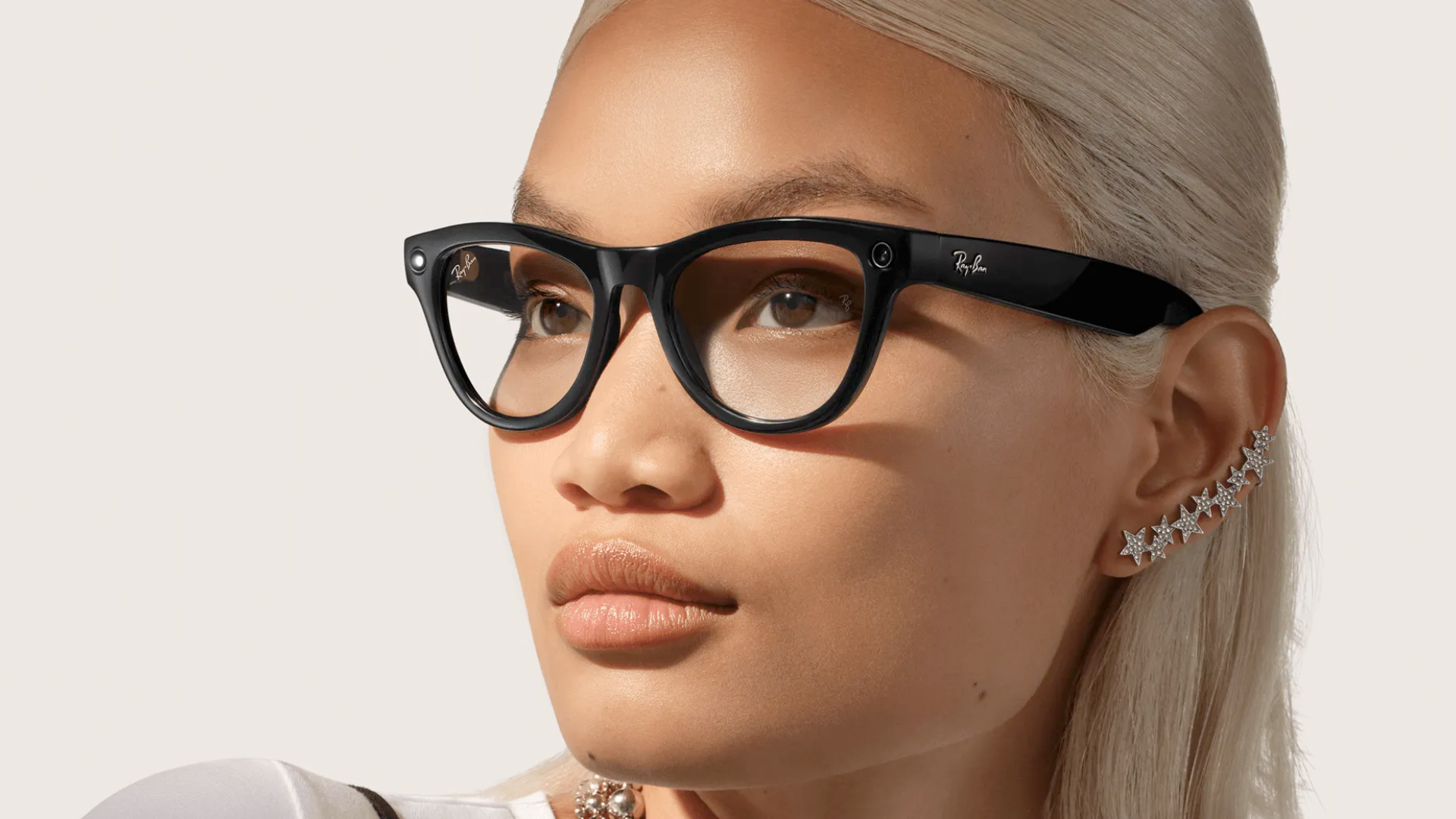 A woman wearing Ray-Ban Meta smart glasses.
