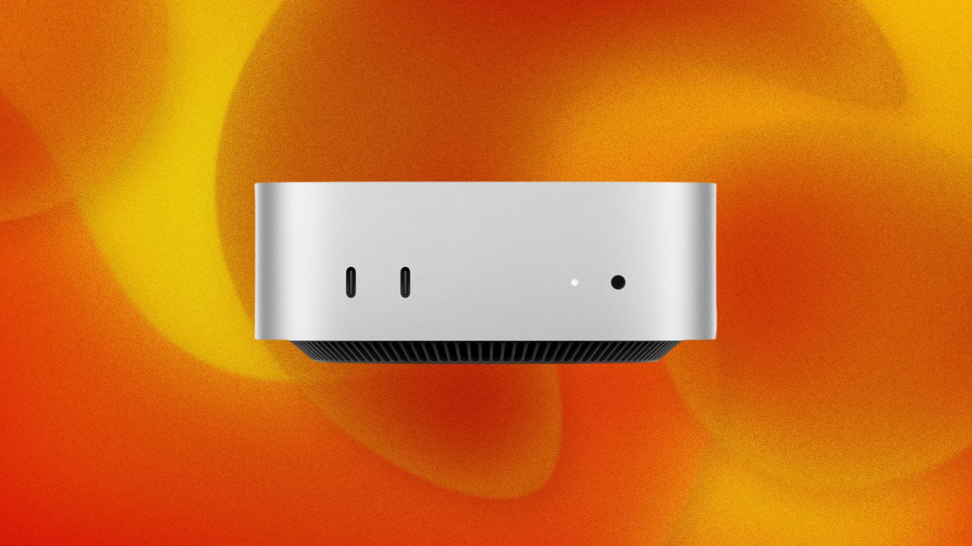 A Mac Mini computer appears on an orange abstract background.
