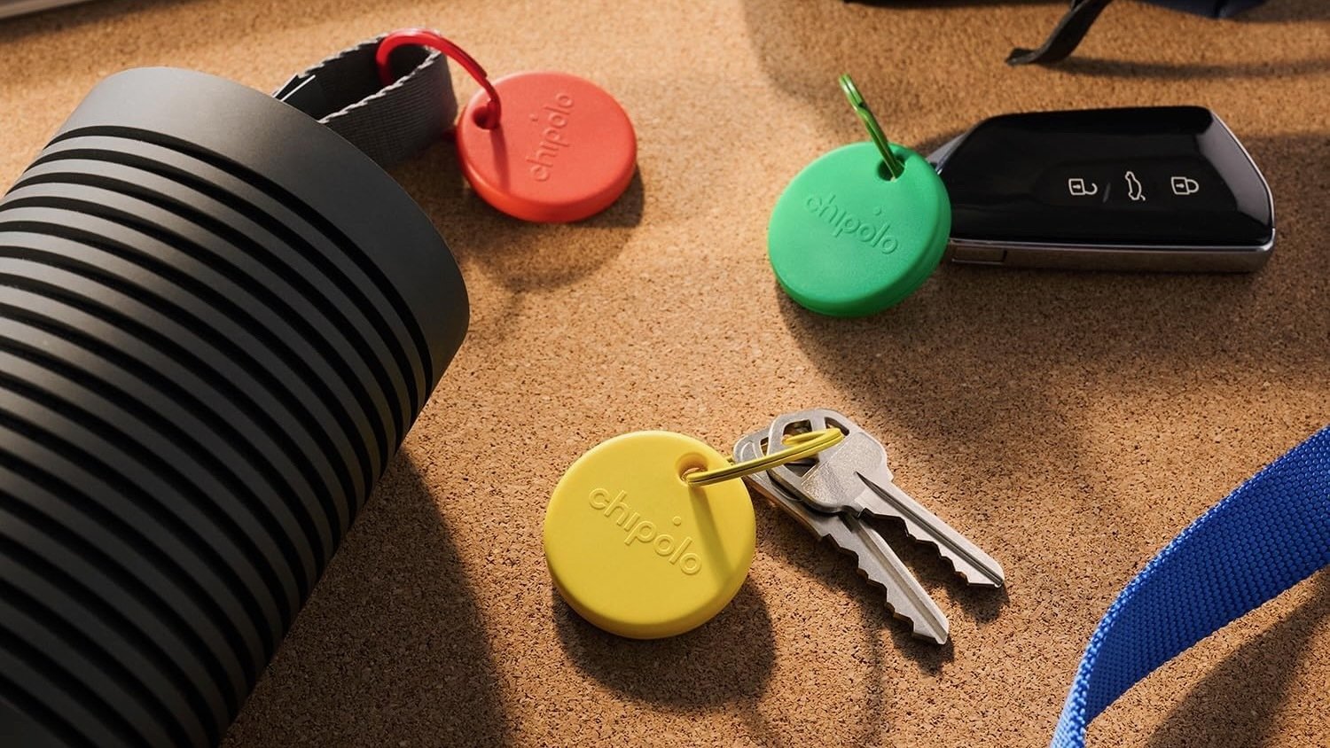 chipolo pop trackers attached to water bottle and keys