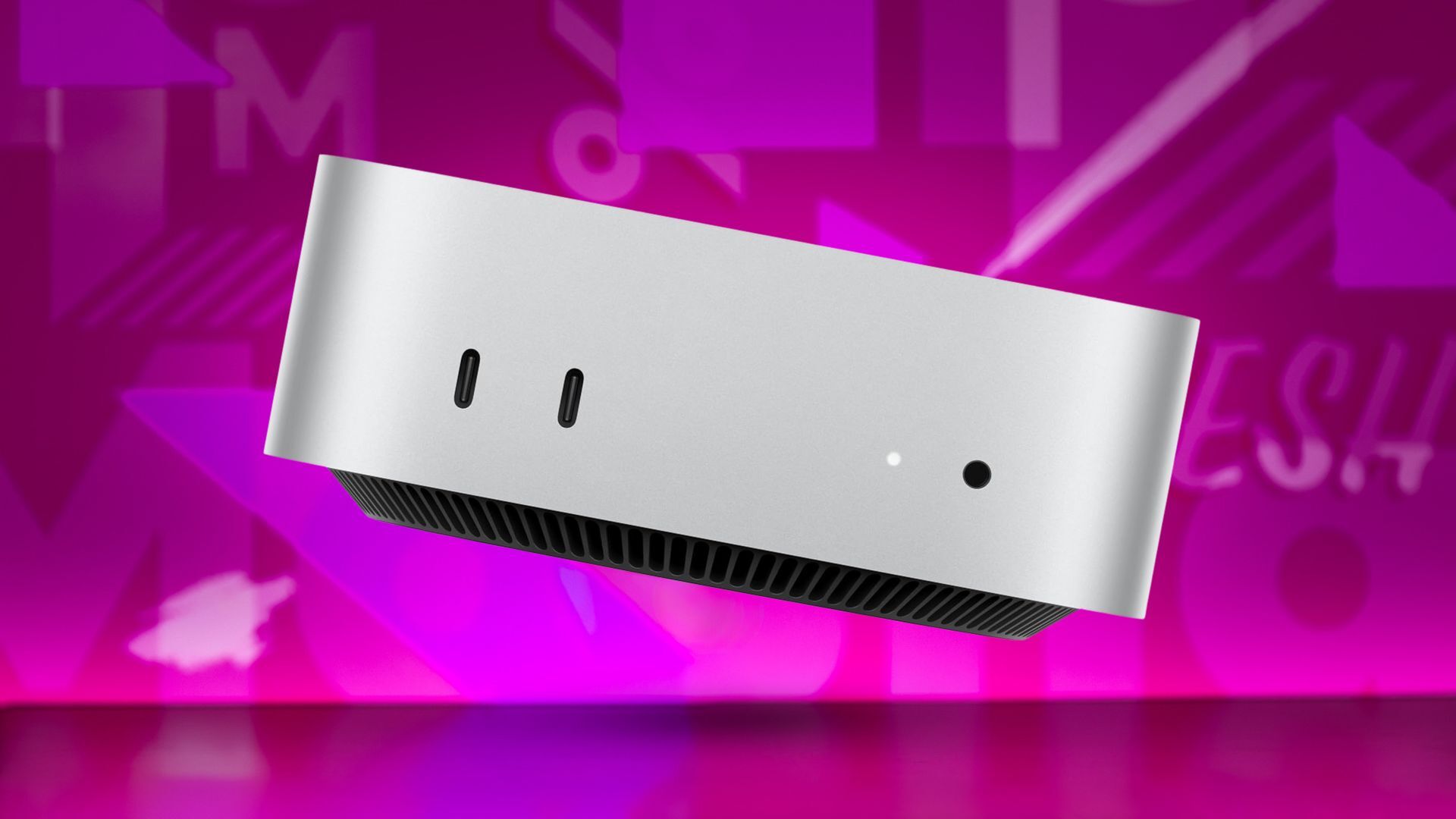 Apple Mac Mini on pink background