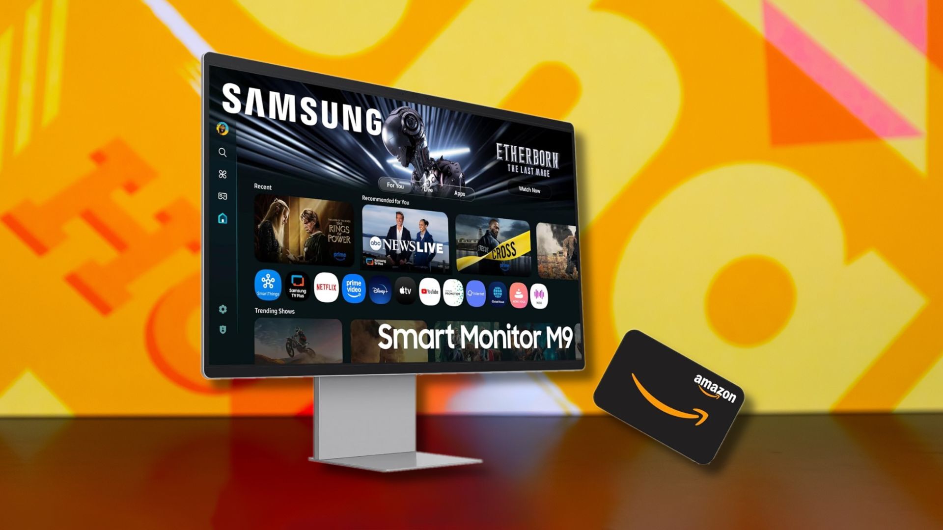 samsung m9 smart monitor and amazon gift card against a yellow patterned background