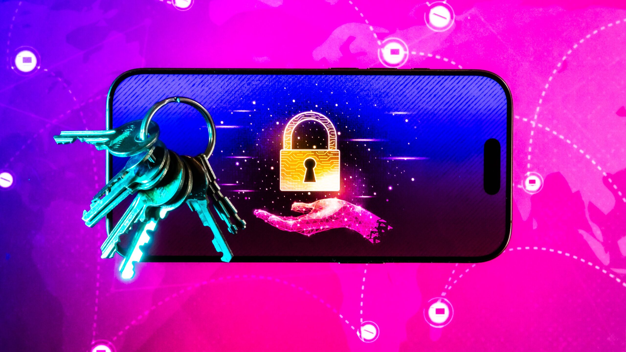 a smartphone displaying an image of an outstretched hand with a lock over it, with keys laid upon its screen