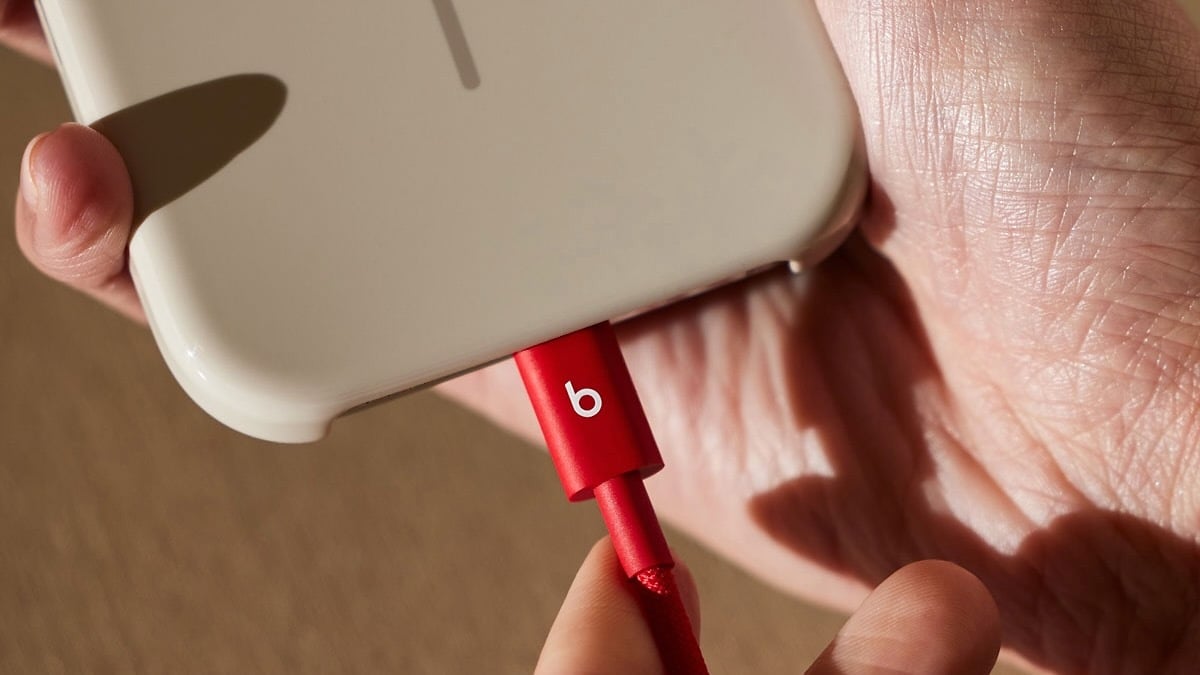 beats charging cable plugged into smartphone