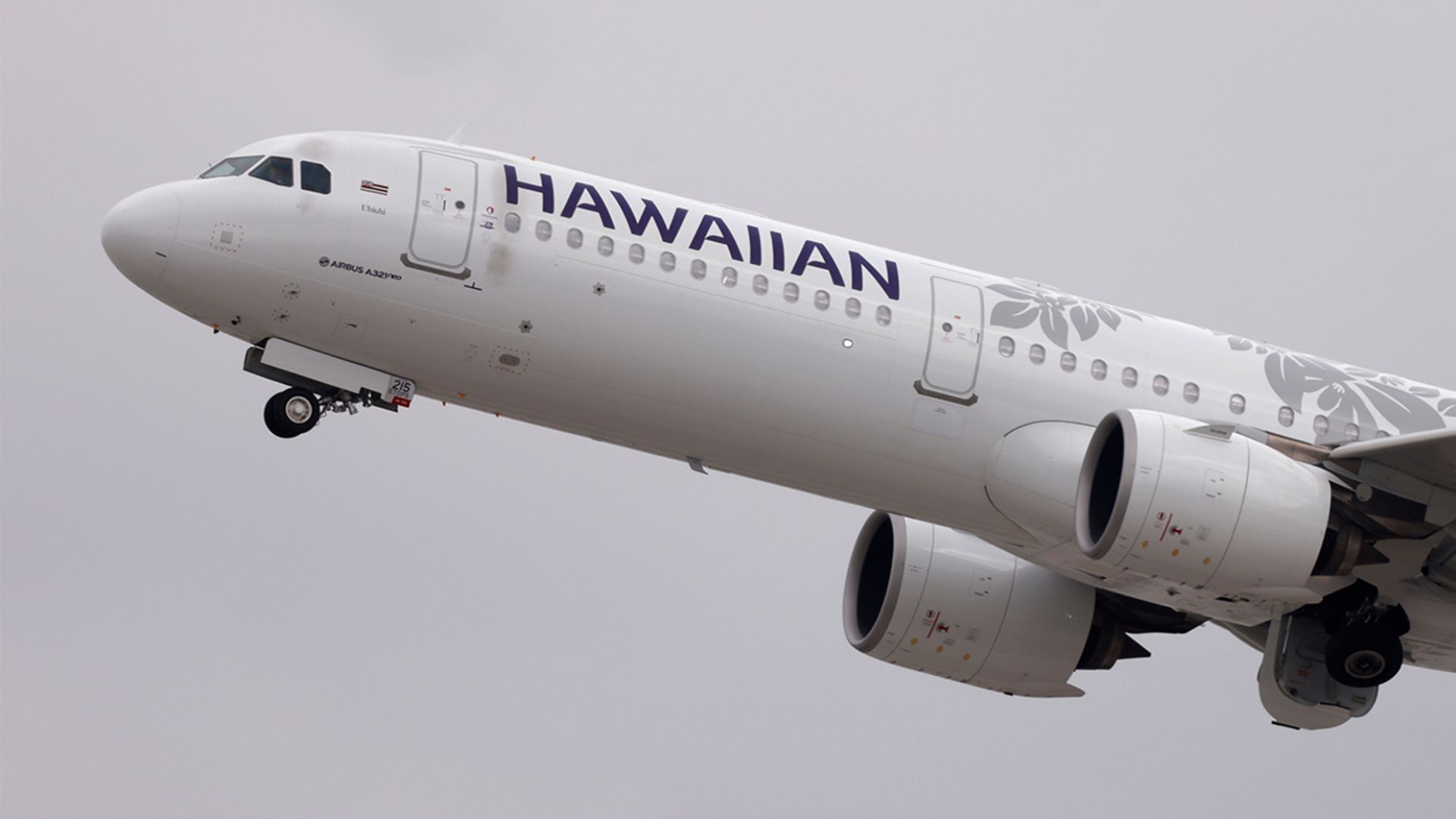 A Hawaiian Airlines plane taking off.