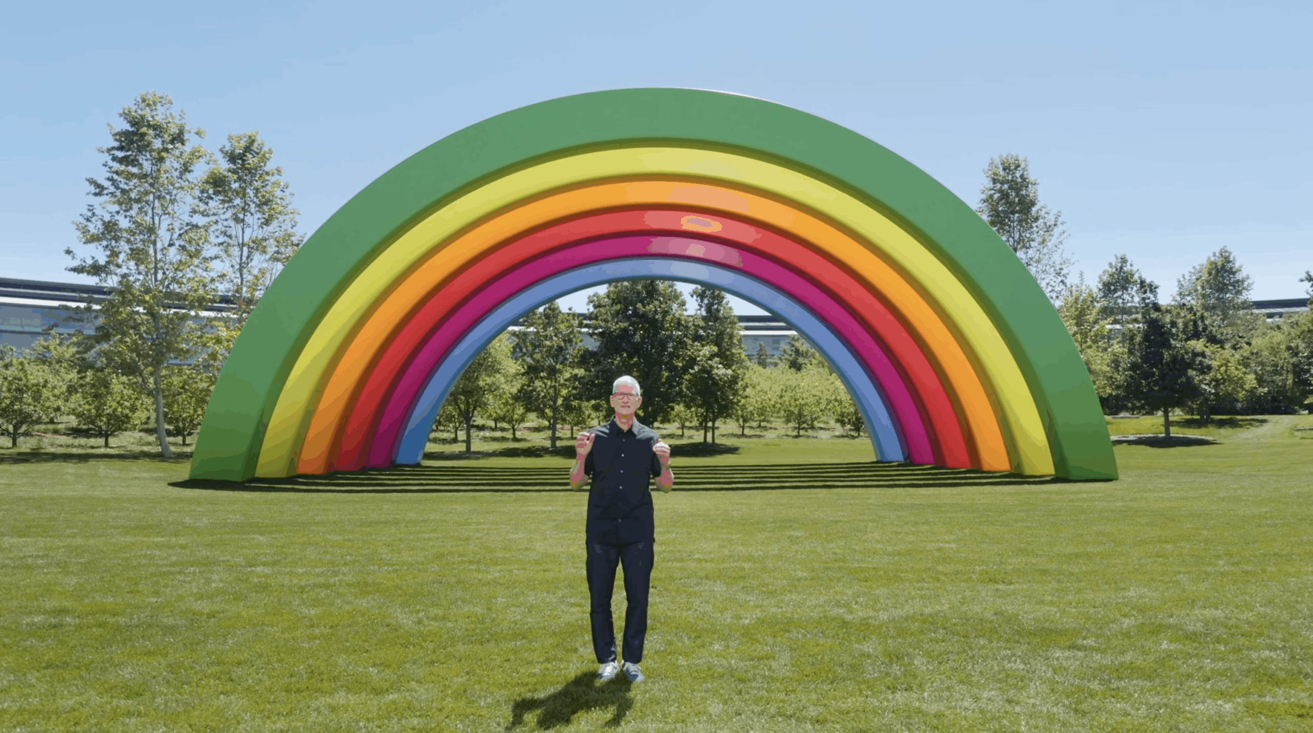 Apple CEO Tim Cook under a rainbow