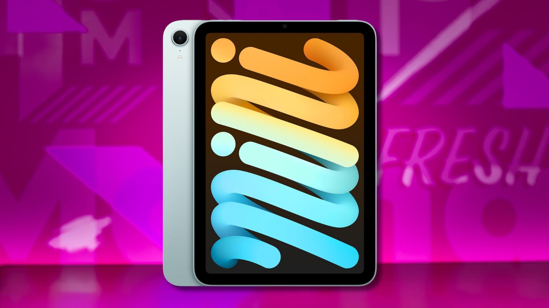 apple ipad mini against a pink patterned background