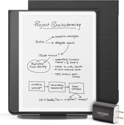 An Amazon Kindle Scribe with cover, power adaptor, and pen.