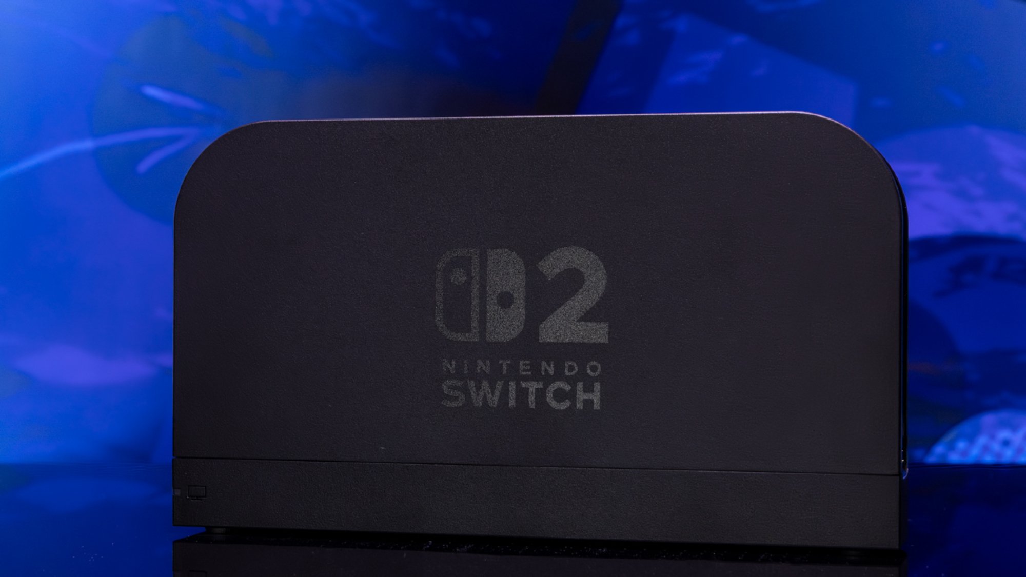 Nintendo Switch 2 dock against blue background