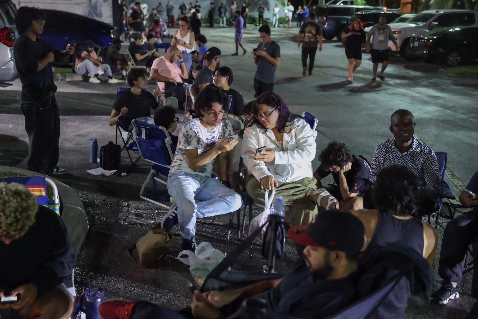 Customers wait in line outside a Best Buy in Pembroke Pines, Florida.