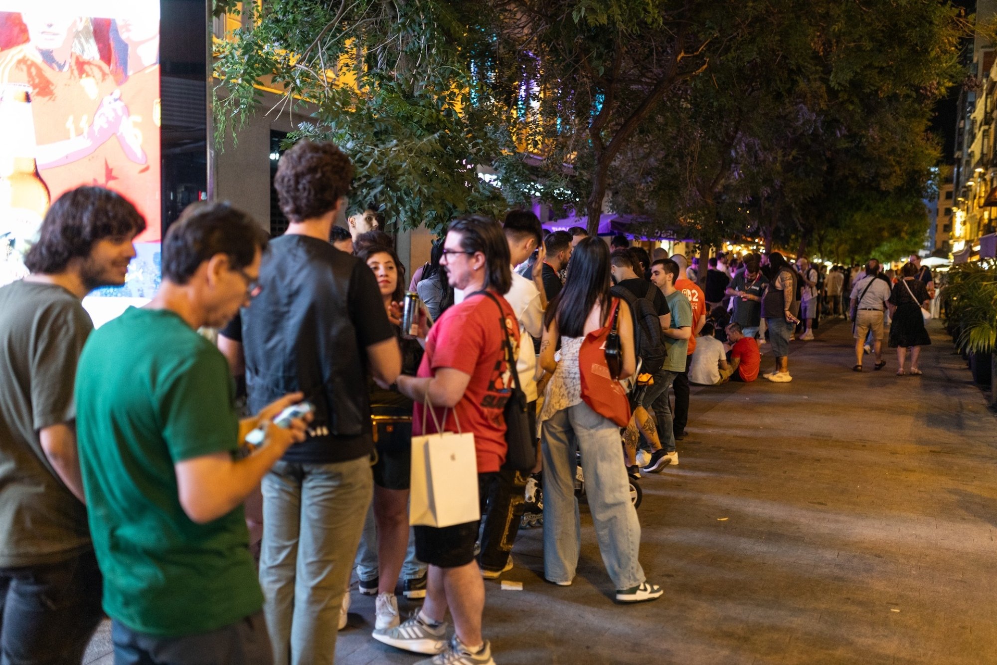 Customers wait in line in outside a Game store in Madrid, Spain.