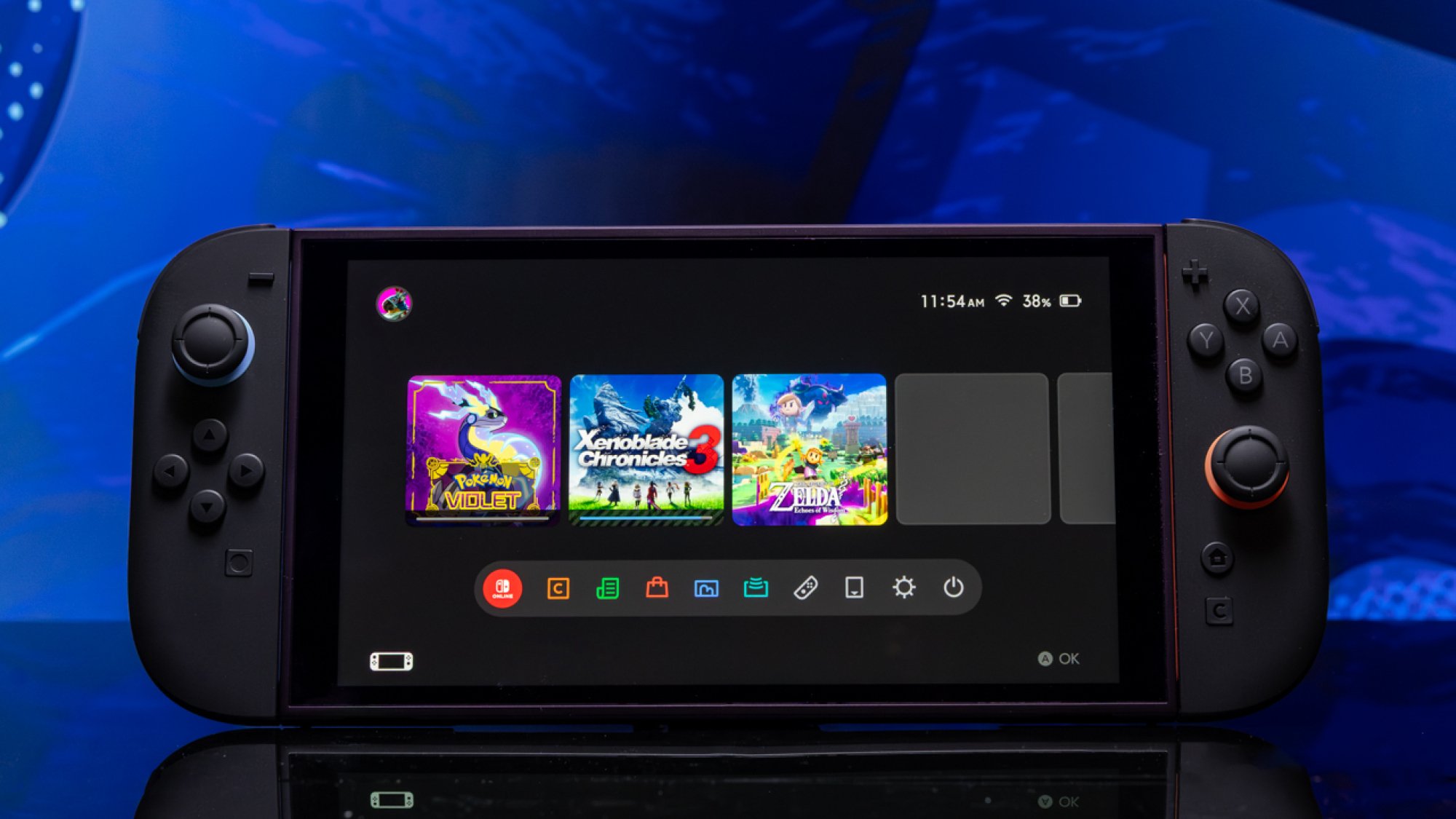 Nintendo Switch 2 from the front against a blue background with the screen turned on