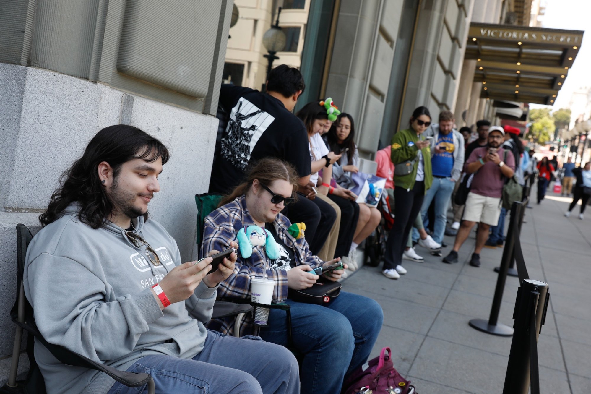 Customers wait in line outside a Nintendo Store in San Francisco, California.