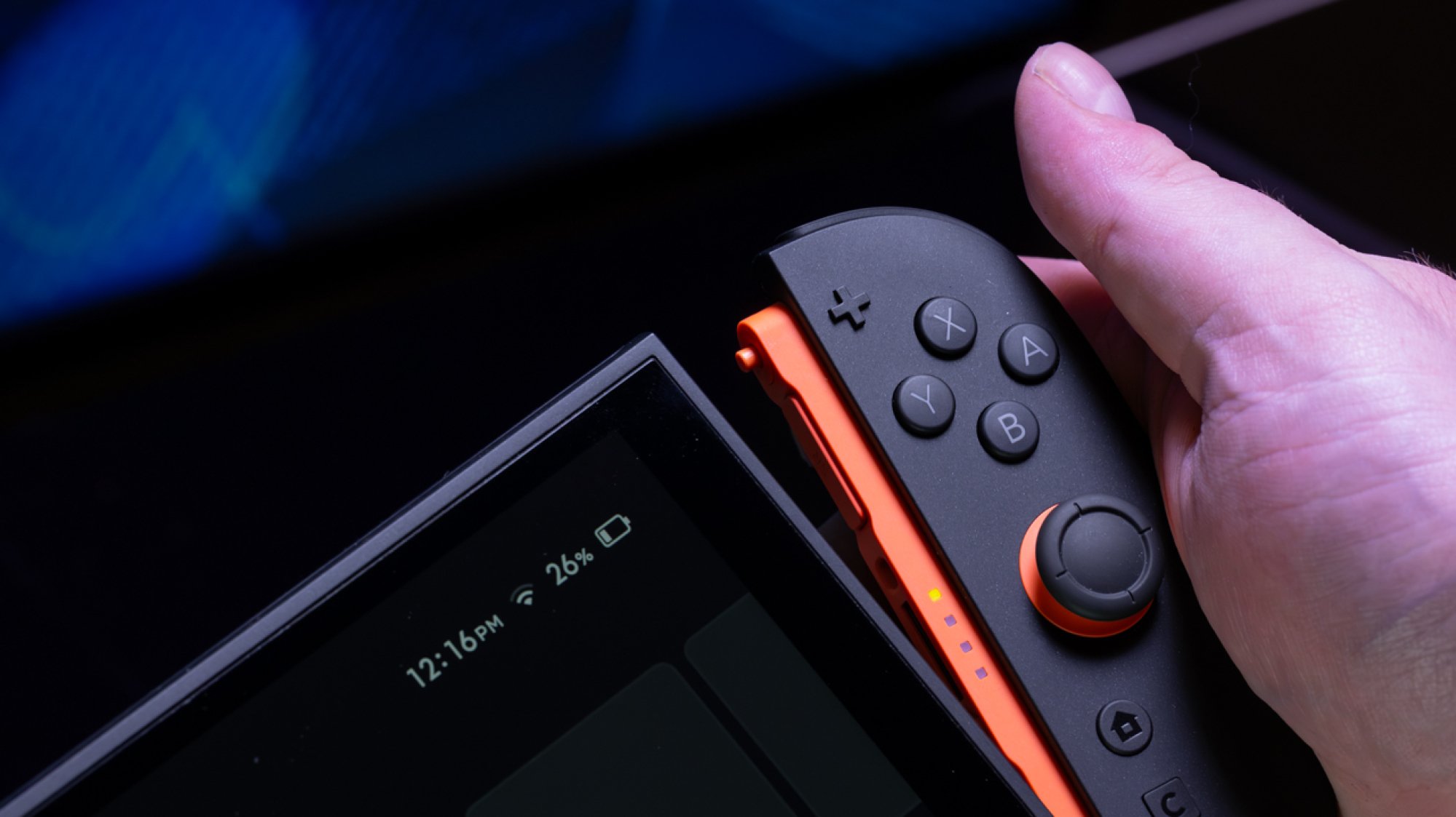 Nintendo Switch 2 Joy-Con controller being detached from the display