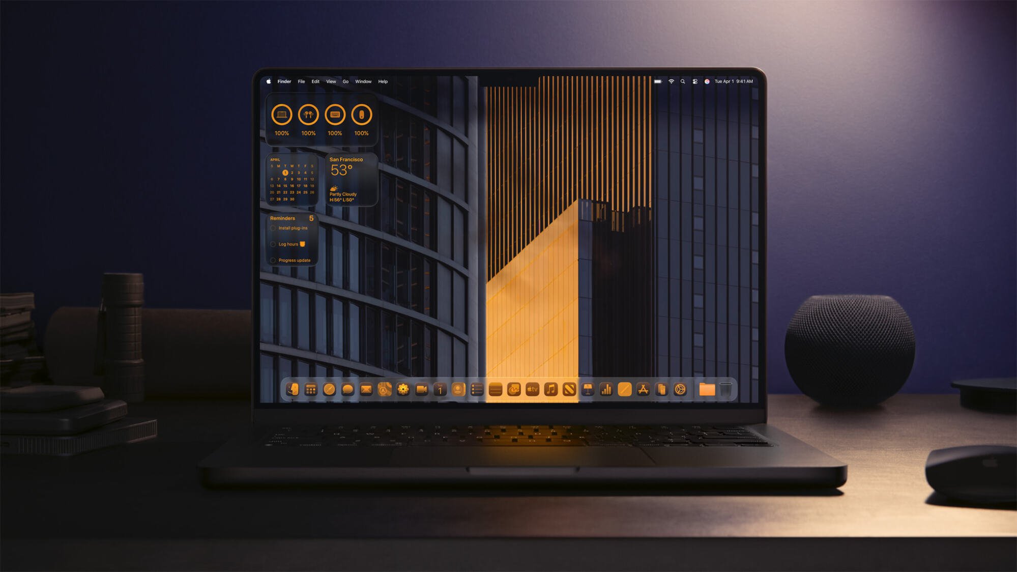 macos 26 on Macbook screen in dark office