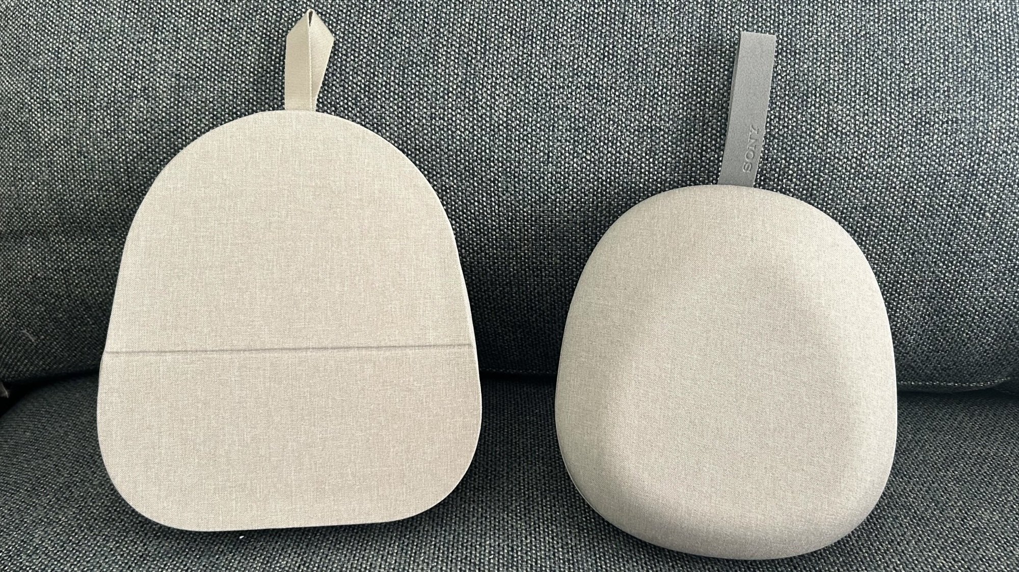 sony xm5 and xm6 headphones cases next to each other on the couch