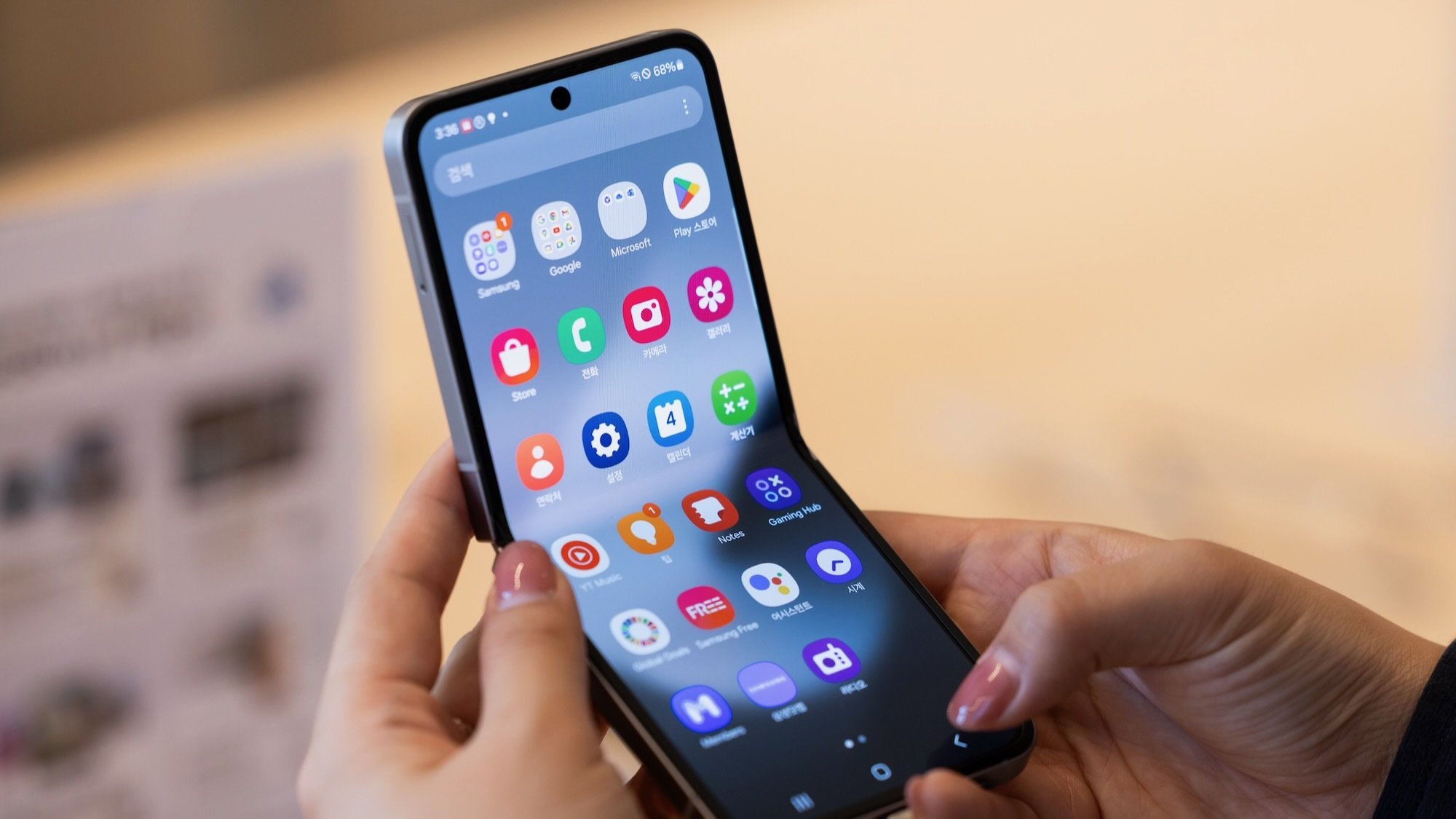close-up of woman holding samsung galaxy z flip 6