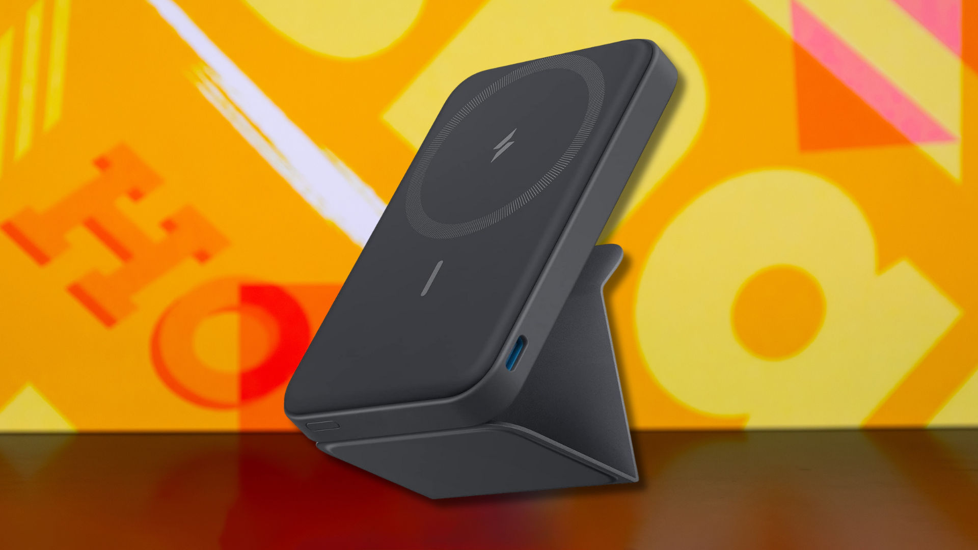 An Anker 622 charger on a colorful background.