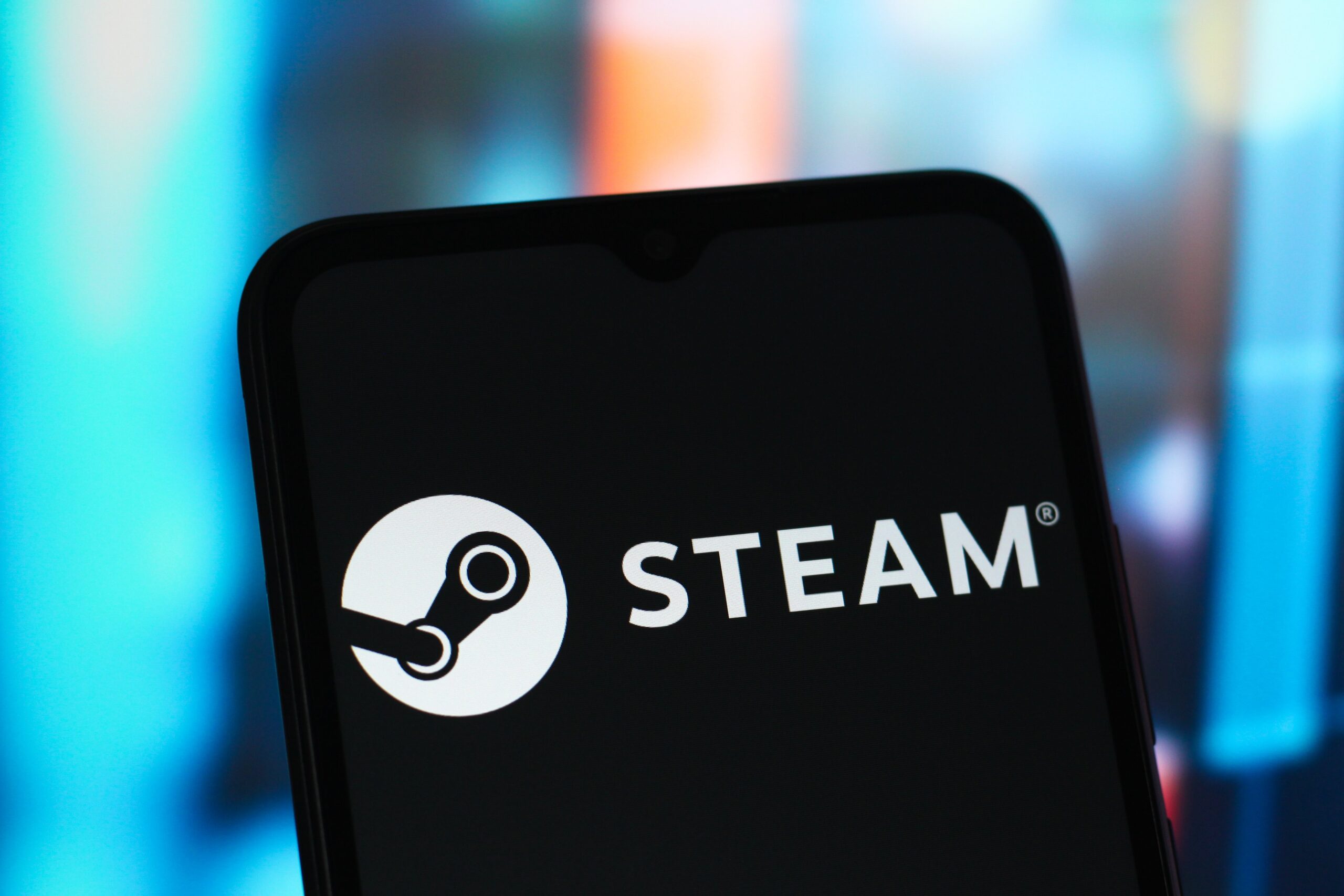 The Steam logo is seen displayed on a smartphone screen.