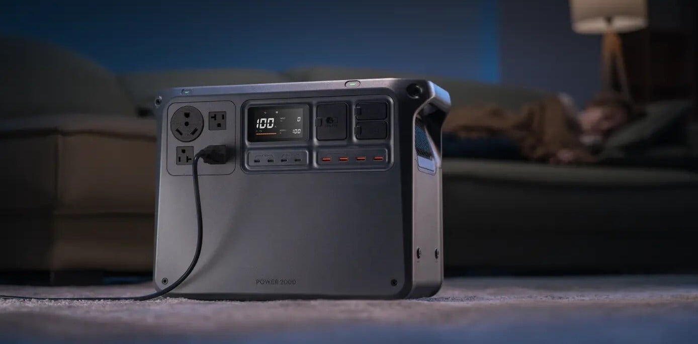 the DJI power 2000 portable power station in a dimly lit room