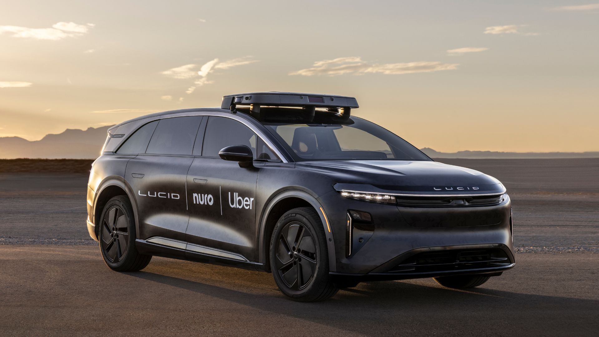 Uber's robotaxi on a road at sunset