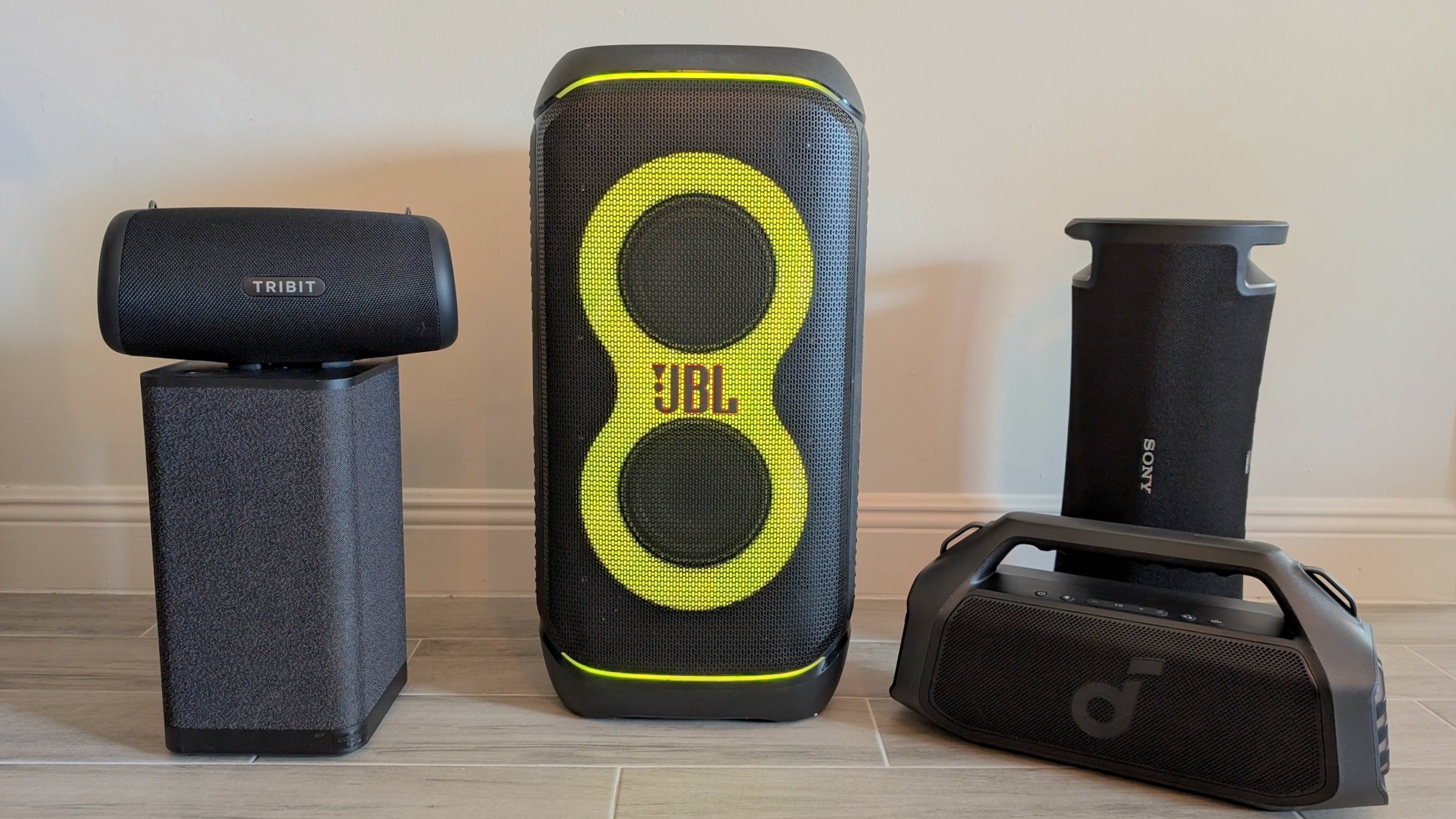 five bluetooth party speakers arranged in a row