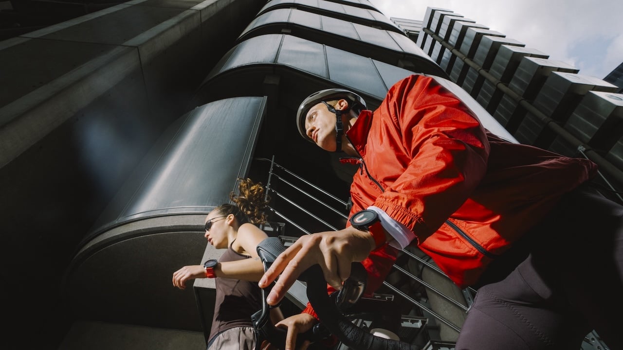Two people wearing the Nothing CMF Watch Pro 3 while exercising
