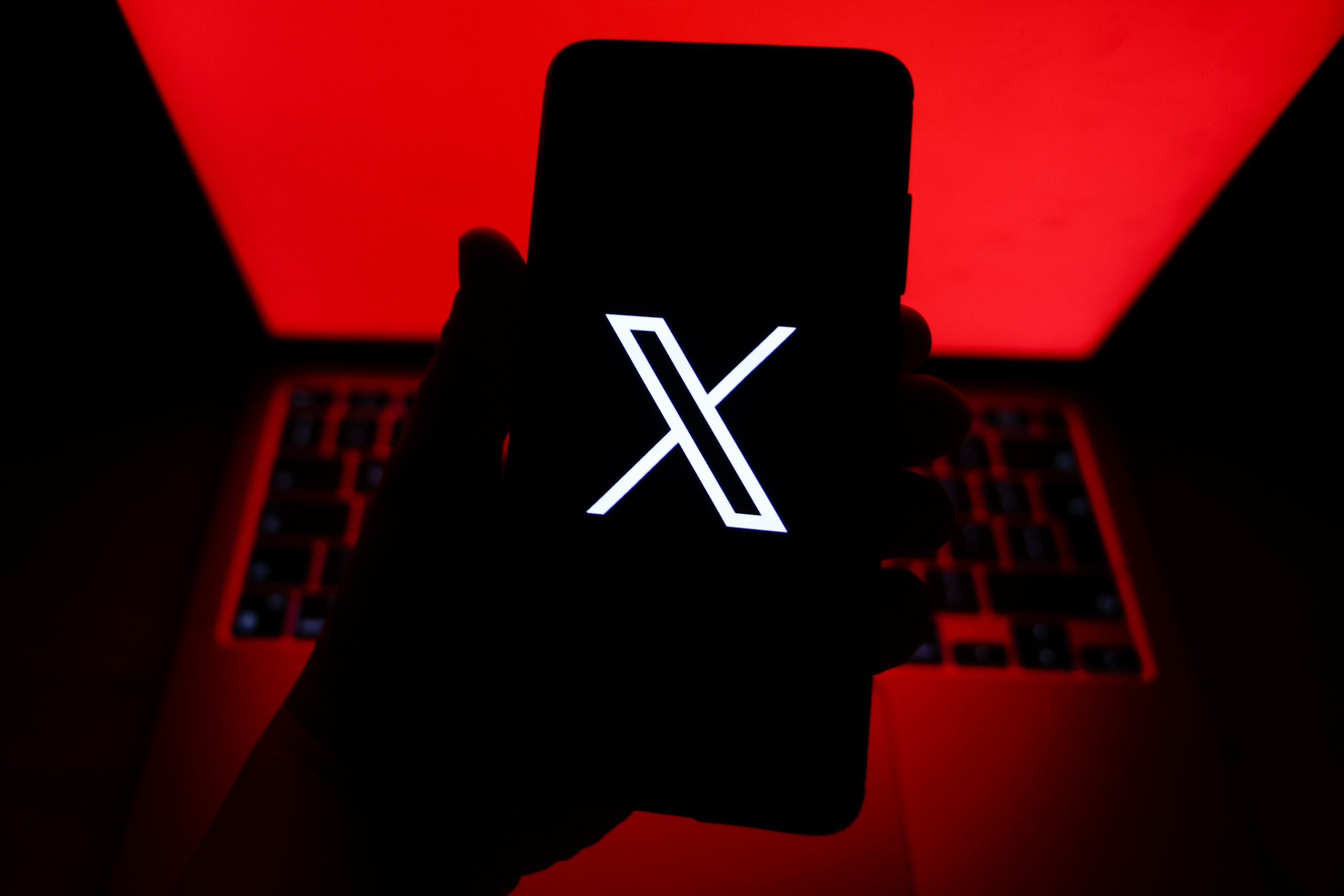 X former Twitter logo is displayed on a mobile phone screen for illustration photo. Gliwice, Poland on July 20th, 2025.