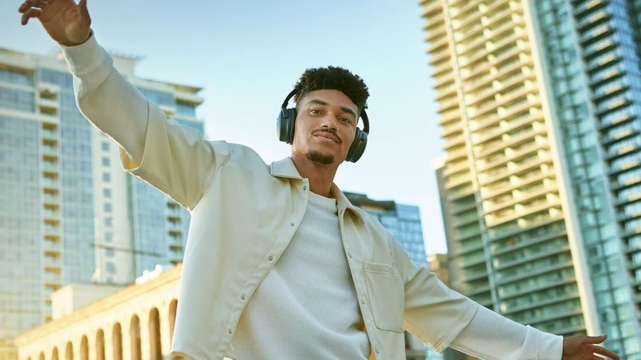 Person wearing the Bose QuietComfort headphones