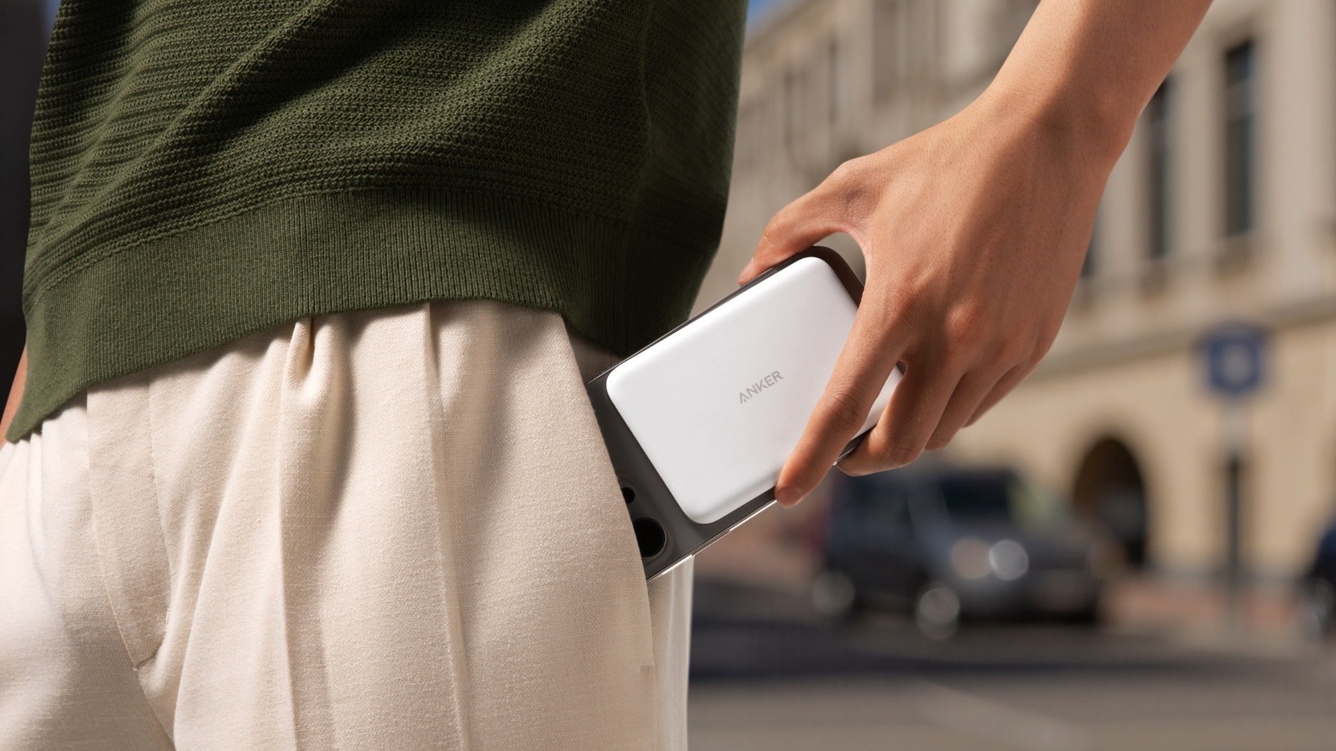 A man slips an anker maggo powerbank into his pocket