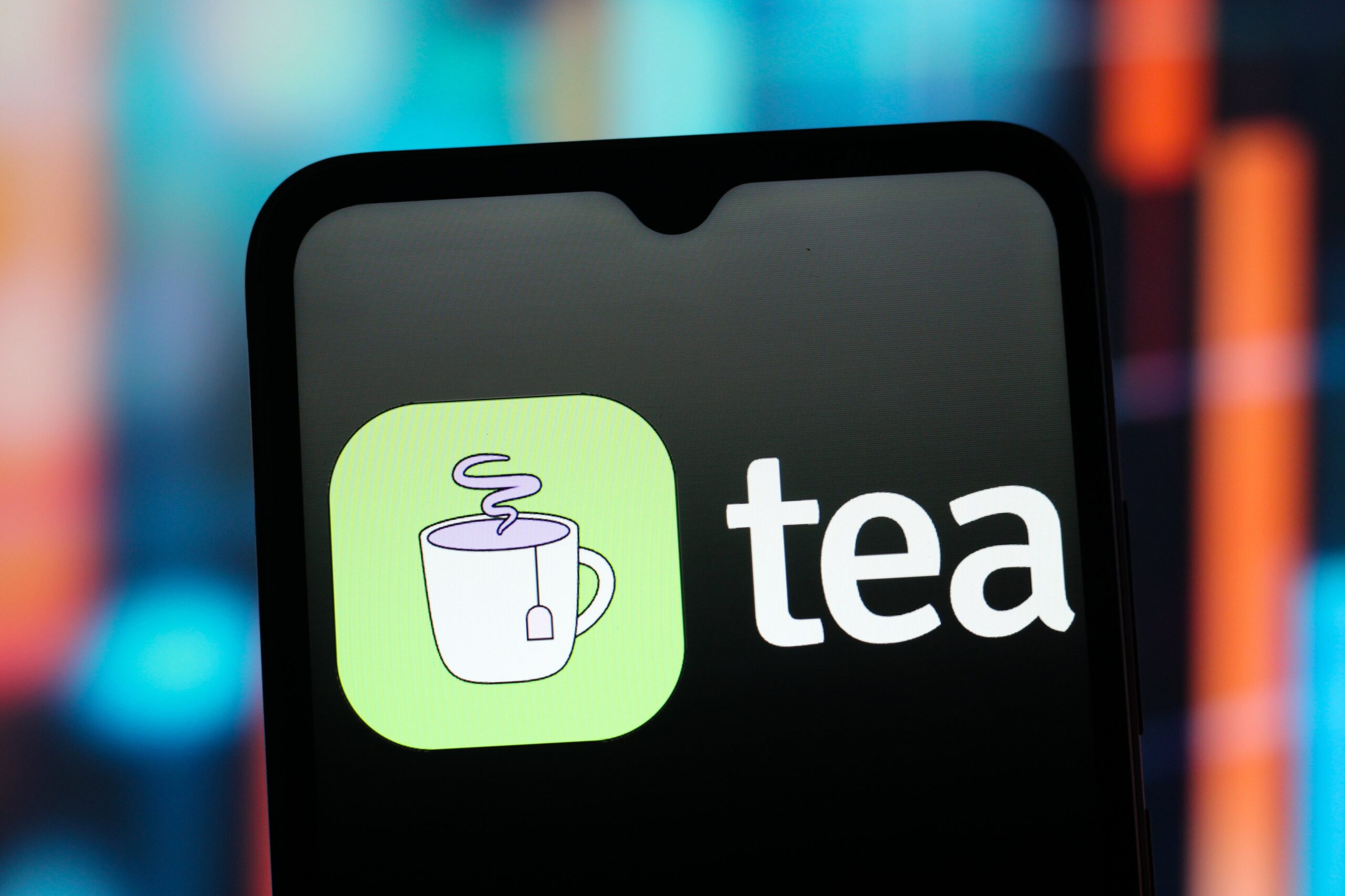 A phone displays the green Tea app icon.