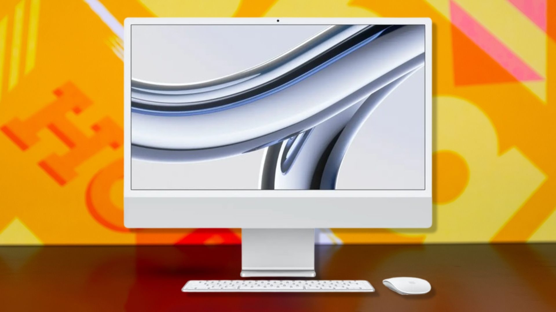 The Apple iMac M3 on an orange background
