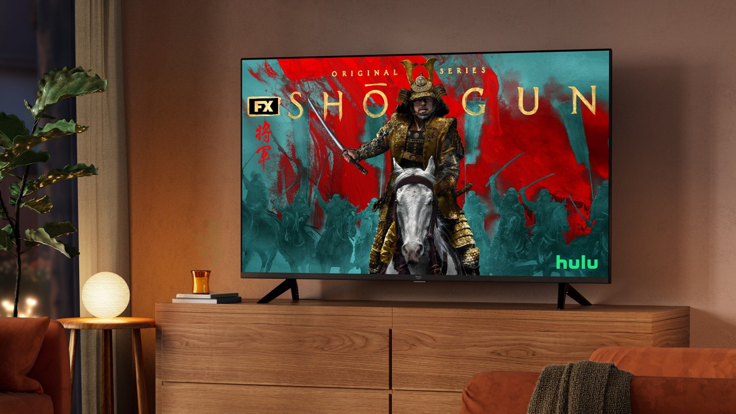 the Amazon Fire TV 4-series displays the show Shogun while set in a dimly lit living room