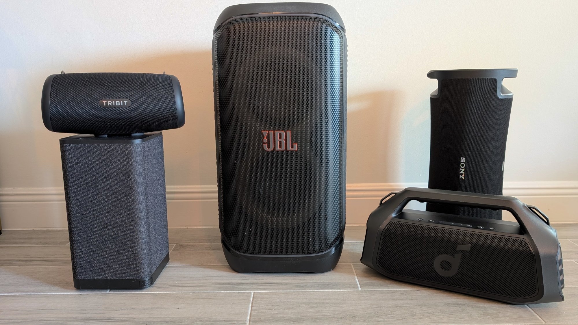 portable party speakers arranged on the floor