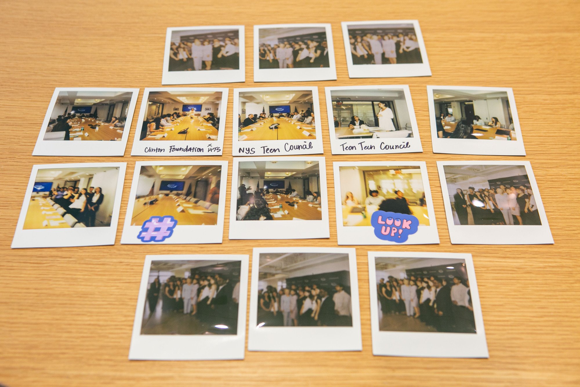 A spread of Polaroid photos taken of the Teen Tech Council.